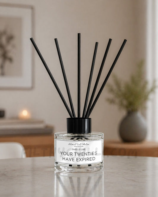 This reed diffuser has a funny label with the quote ‘Smells Like Your Twenties Have Expired'. The reed diffuser label is white with black text and black border. It has the collection name of Antisocial Scent Collection at the top and funny quote in the centre. Our reed diffusers have three optional scents, French Vanilla, Plum & Rhubarb or Candy Floss. The reed diffusers are supplied with eight black wicks poured in clear circular glass jars.